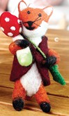 This friendly fox is made of felted wool over wire in the arms and tail allow for a full range of expression. 5.5"h x 2.5"w x 3"d
